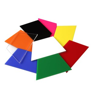 May include: A set of seven colorful acrylic sheets in various shapes, including a square, a rectangle, and a diamond. The sheets are arranged in a circular pattern, with the white sheet in the center.