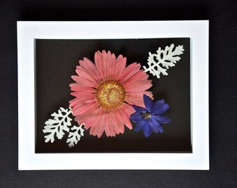 Peach gerbera daisy with delphinium and dusty miller in 6x8 white float frame