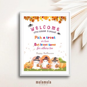 May include: A framed Halloween-themed print with a white border. The text reads "Welcome Little Goblins & Ghouls! Pick a treat or two But leave some for others too. Happy Halloween." The image features cartoon ghosts, pumpkins, and fall leaves.