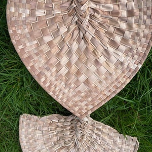 Authentic Pacific Island tropical coconut palm pandanus heart handicraft. Indigenous practical island art. Island practical artefact.
