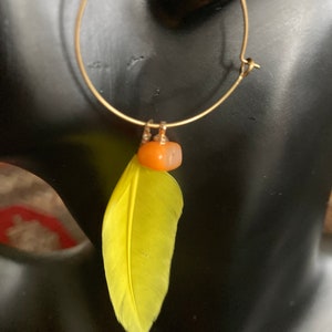 Gold feather & orange coral brass hoops, brilliant salmon tooth coral and yellow feather matt gold brass dangle drop dramatic earrings.