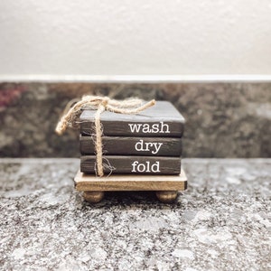 Wash dry fold laundry room farmhouse wooden bookstack book stack home decor