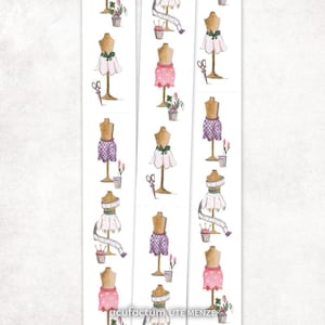 May include: Watercolour illustrations of dress forms with various skirt designs, including pink, white, and purple patterns. Each form is accompanied by scissors, a pot of flowers, and a sewing kit. The text "acufactum UTE MENZE" is at the bottom.