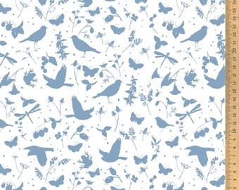 May include: A white fabric with a repeating pattern of blue silhouettes of birds, butterflies, dragonflies, and plants. The fabric has a ruler along the right edge.