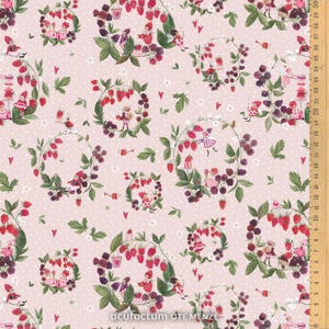 May include: A charming fabric pattern with berry wreaths, miniature figures, and hearts on a pale pink backdrop. The wreaths are made of red strawberries and dark blackberries, with green leaves and white flowers. The text "acufactum UTE MENZE" is visible.