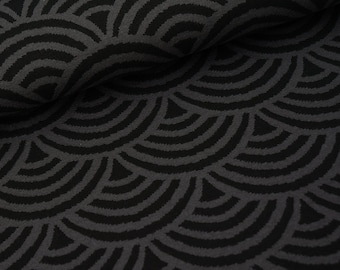 May include: Black and gray fabric with a repeating pattern of overlapping semicircles.