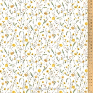Könnte beinhalten: Weißer Stoff mit einem sich wiederholenden Muster aus gelben Wildblumen und grünen Stielen. Der Stoff wird mit einem Lineal in Zoll gemessen.