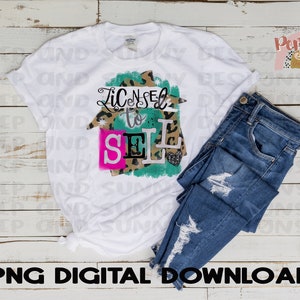 May include: A white t-shirt with a green, pink, and black graphic that says "Licensed to Sell". The graphic is a house shape with a leopard print pattern.