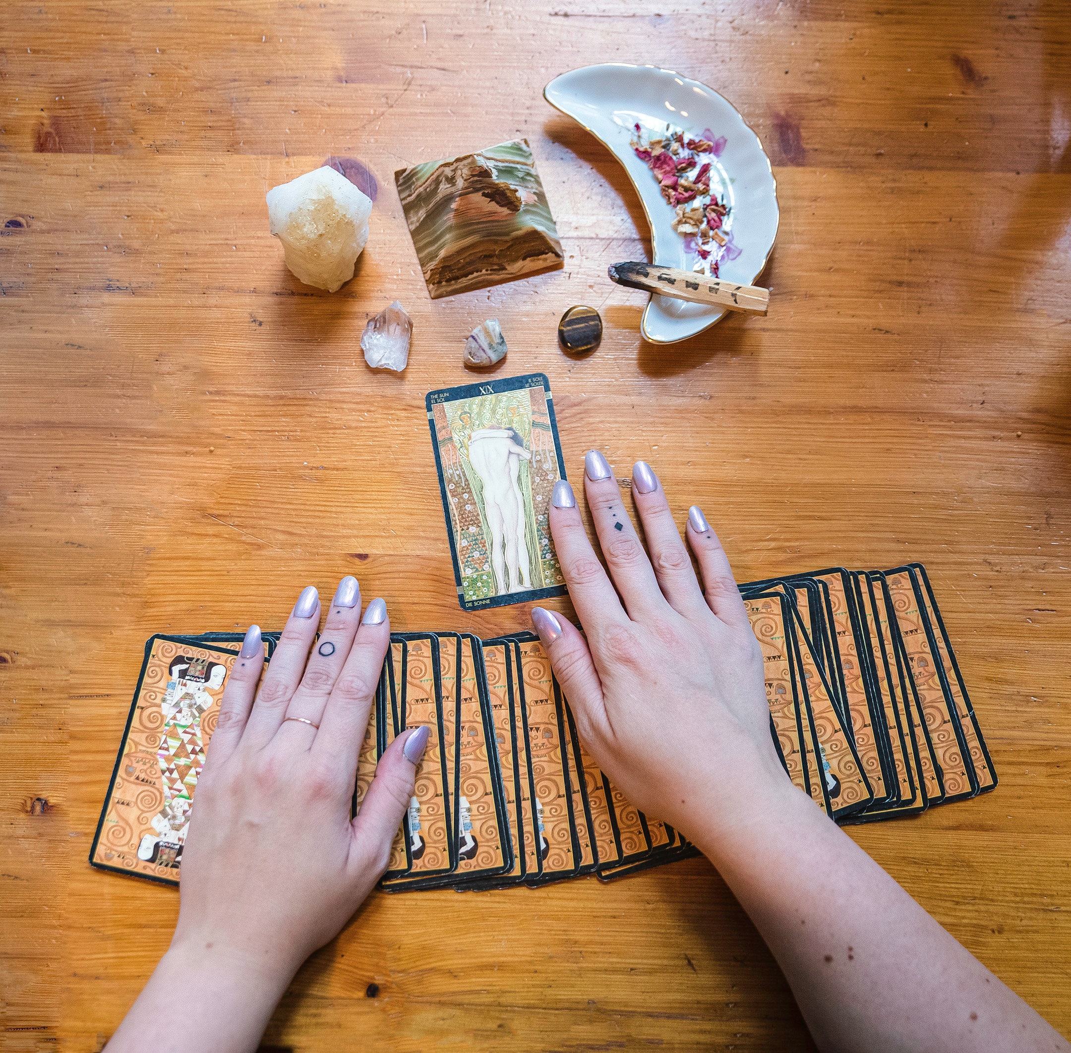 Tarot cards spread on a mystical cloth, symbolizing the art of divination and self-reflection