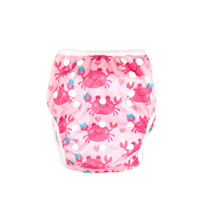 May include: Pink reusable swim diaper with a white trim and a pattern of pink crabs, hearts, and stars.
