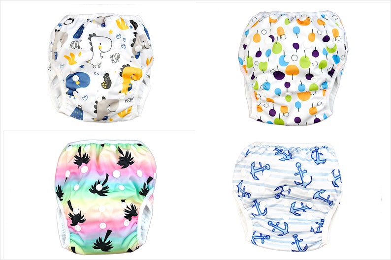 May include: Four different swim diapers with various colorful patterns. The patterns include dinosaurs, fruits, palm trees, and anchors.