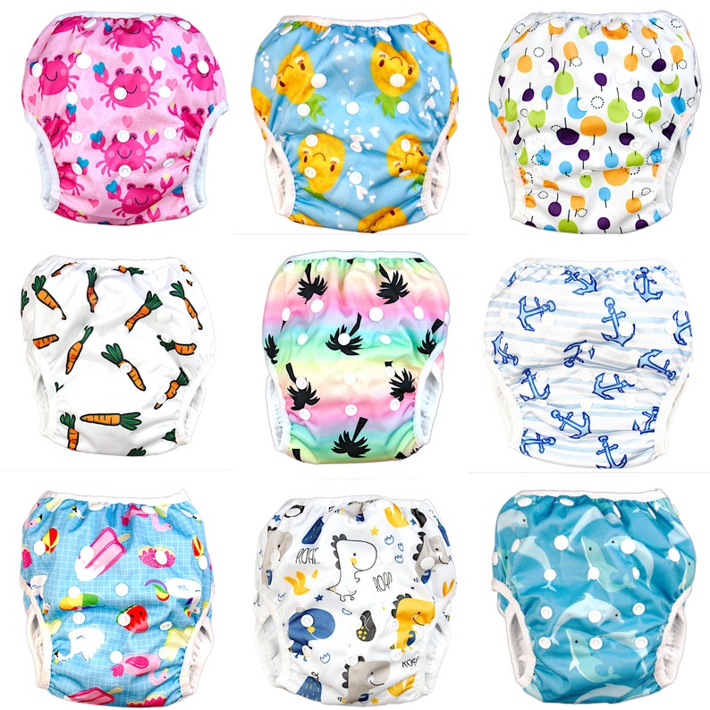 May include: Nine different swim diapers with various colorful patterns. The patterns include crabs, pineapples, anchors, carrots, palm trees, dolphins, and dinosaurs.