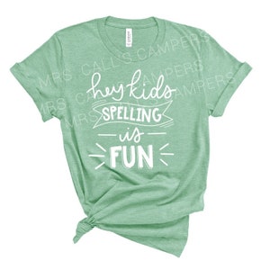 Hey Kids Spelling is Fun Teacher T-Shirt (white text)