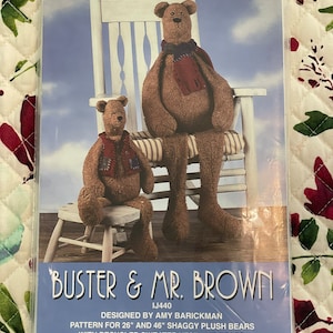 May include: A pattern for making two plush teddy bears, Buster and Mr. Brown, with recycled sweater vests and scarves. The pattern is for 26" and 46" bears. The pattern is by Indygo Junction, Inc.