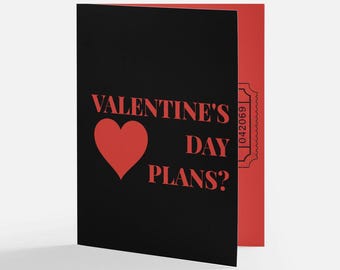May include: A Valentine's Day card with a black cover featuring the text "VALENTINE'S DAY PLANS?" in red, along with a red heart. The inside of the card is red, with a ticket-style design.