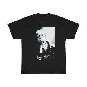 May include: Black t-shirt with a white and blue image of a man with a signature that reads "Lou Reed" in a glitchy font.