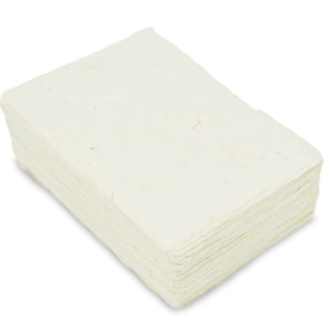 May include: A stack of off-white handmade paper sheets. The paper is made from natural fibers and has a slightly textured surface.