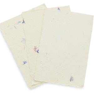 May include: Three rectangular sheets of off-white handmade paper with deckled edges. The paper has a textured, fibrous surface embedded with small, scattered dried flower petals in shades of blue, purple, and pink, creating a natural appearance.