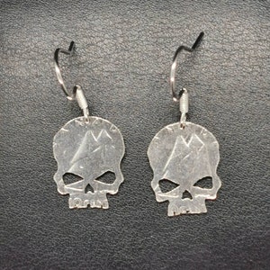 Silver dime skull earrings