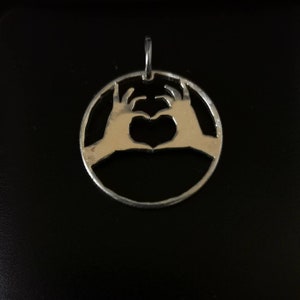 Silver quarter &quot;heart hands&quot; hand cut coin Pendant necklace.