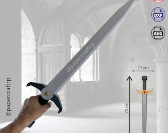 May include: A papercraft sword model with a silver blade and black handle. The sword is 70 cm long and 17 cm wide. The model is shown in a hand holding it. The image also includes the text "@papercrafttrp".