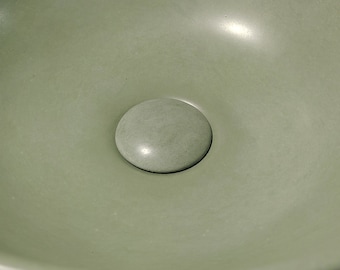 Concrete drain stopper.  Top sink pop-up plug concrete stopper.