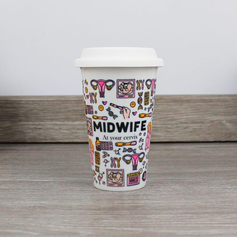 May include: White travel mug with a pink and black design featuring the word "MIDWIFE" and the phrase "At your cervix". The mug is covered in illustrations of medical symbols, including a uterus, a fetus, and a DNA strand.