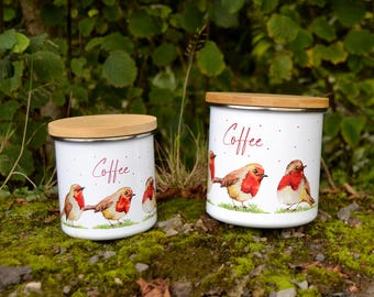 May include: Two white ceramic canisters with bamboo lids, featuring a watercolor design of robins and the word "Coffee".