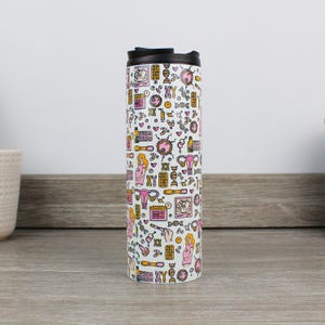 May include: White travel mug with a black lid and a pattern of pink and yellow illustrations related to pregnancy, including a pregnant woman, a uterus, a baby, and a calendar. The text "XY" is repeated throughout the pattern.