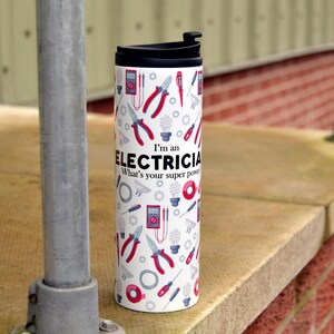 May include: White travel mug with a black lid and a pattern of electrical tools and the text "I'm an Electrician. What's your super power?"