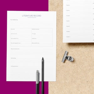 May include: A white sheet of paper with the title "LITERATURE RECORD" at the top. The paper is divided into sections with headings such as "Full reference", "Keywords", "Methods employed", "Methodology", and "Findings & answers". There are two pens and a binder clip on the paper.