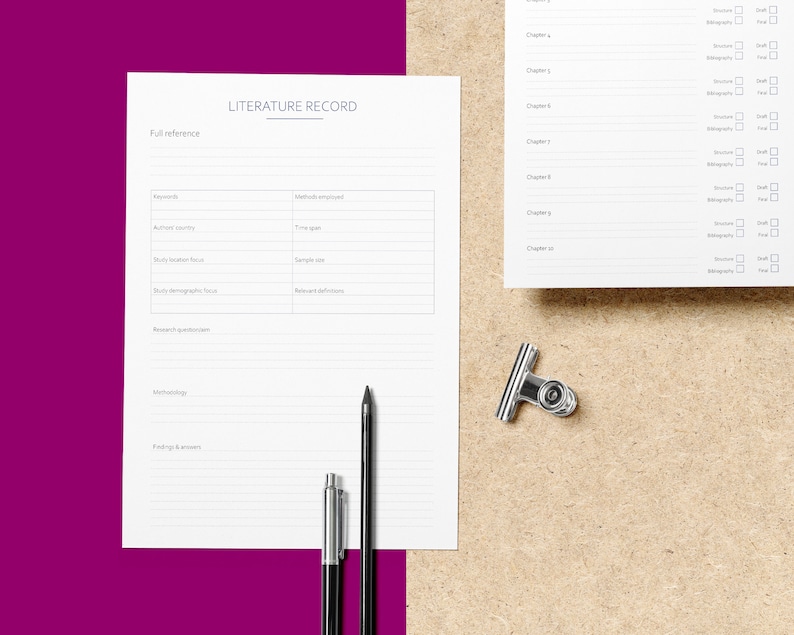 May include: A white sheet of paper with the title "LITERATURE RECORD" at the top. The paper is divided into sections with headings such as "Full reference", "Keywords", "Methods employed", "Methodology", and "Findings & answers". There are two pens and a binder clip on the paper.