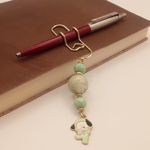 Portalápices con dije: Clip de papel con forma de perro verde, accesorio para agenda