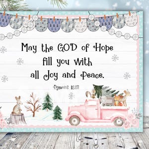 May include: A pink vintage truck with a Christmas tree and woodland animals on the back. The truck is driving through a winter scene with snowflakes and a quote that reads "May the GOD of Hope fill you with all Joy and Peace. Romans 16:18"