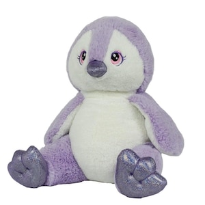 A purple and white stuffed penguin toy with glittery feet and large eyes sits on a white background.