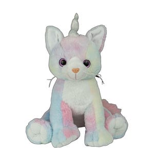 A plush toy cat with a unicorn horn sits on a white background.
