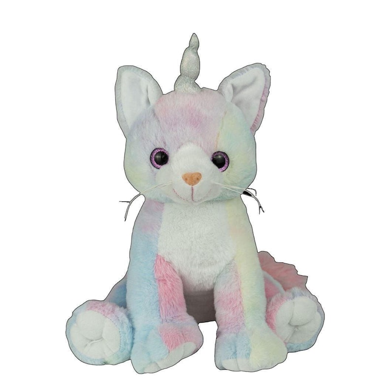 A plush toy cat with a unicorn horn sits on a white background.