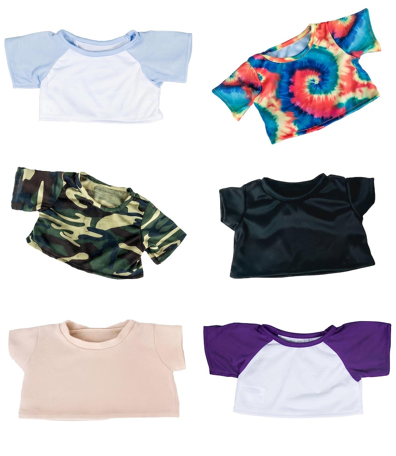 a variety of colorful t-shirts, including a blue and white top, a tie-dye top, a camouflage top, a black top, a white top, and a purple top.