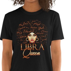 May include: Black t-shirt featuring a brown and gold graphic of a woman's face with the words "LIBRA Queen" underneath. The graphic is surrounded by words such as "Black", "Queen", "Educated", "Smart", "Talented", and "Beautiful".