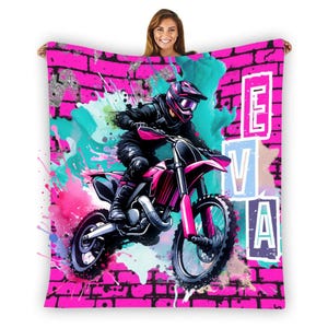 May include: Pink and blue watercolor design with a pink and black dirt bike. The background is a pink brick wall with the name "EVA" in white letters.