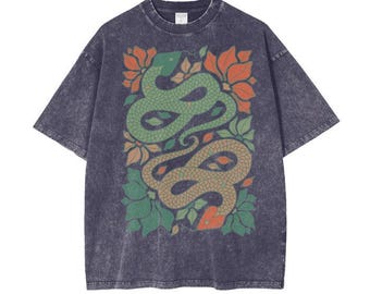May include: A dark gray t-shirt with a vintage wash featuring a graphic print of two green snakes intertwined with orange and green floral designs.