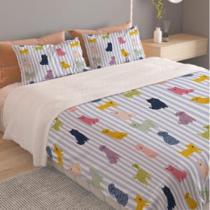 May include: A bedding set featuring a light blue and white vertical striped pattern decorated with small, colorful dog illustrations in shades of yellow, pink, navy blue, and green, including two matching pillowcases and a large comforter.