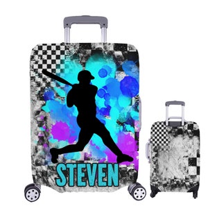 May include: A luggage cover with a black and white checkered pattern and a blue and purple watercolor design. A silhouette of a baseball player is in the center of the design. The name "STEVEN" is written in blue at the bottom of the cover.