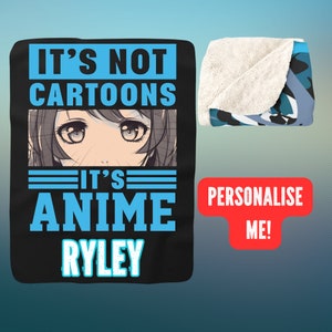 May include: Black and blue fleece blanket with the text "It's not cartoons, it's anime Ryley" and an anime-style illustration of a girl's eyes. The blanket is folded in half and there is a red button with the text "Personalise Me!" on the right side of the image.