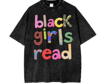 May include: Black t-shirt with a vintage wash and a colorful graphic that reads "black girls read".