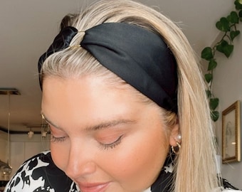 Beautiful black satin headband with a ring gold color