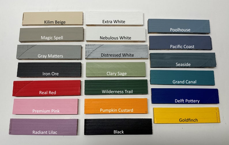 May include: A color chart with 20 paint color swatches. The swatches are arranged in 5 rows of 4. The colors include Kilim Beige, Extra White, Poolhouse, Magic Spell, Nebulous White, Pacific Coast, Gray Matters, Distressed White, Iron Ore, Clary Sage, Seaside, Grand Canal, Real Red, Wilderness Trail, Delft Pottery, Premium Pink, Pumpkin Custard, Radiant Lilac, Black, and Goldfinch.