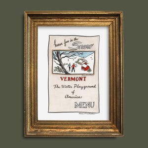 May include: A framed vintage print with a gold-colored wooden frame. The print features a winter scene with skiers, a red barn, and the text "Have fun in the Snow" and "Vermont, The Winter Playground of America, MENU."