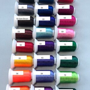 May include: A color chart of 13 rows of thread spools, each row labeled with a number from 50 to 73. The thread colors include black, gray, brown, red, orange, yellow, blue, purple, pink, and green.