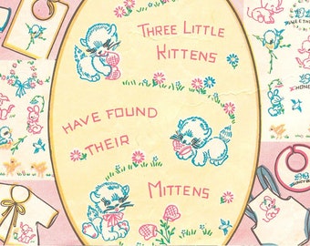 May include: A vintage sheet of iron-on transfers featuring illustrations of kittens, a baby bib, and a baby outfit. The text reads "Three Little Kittens Have Found Their Mittens".